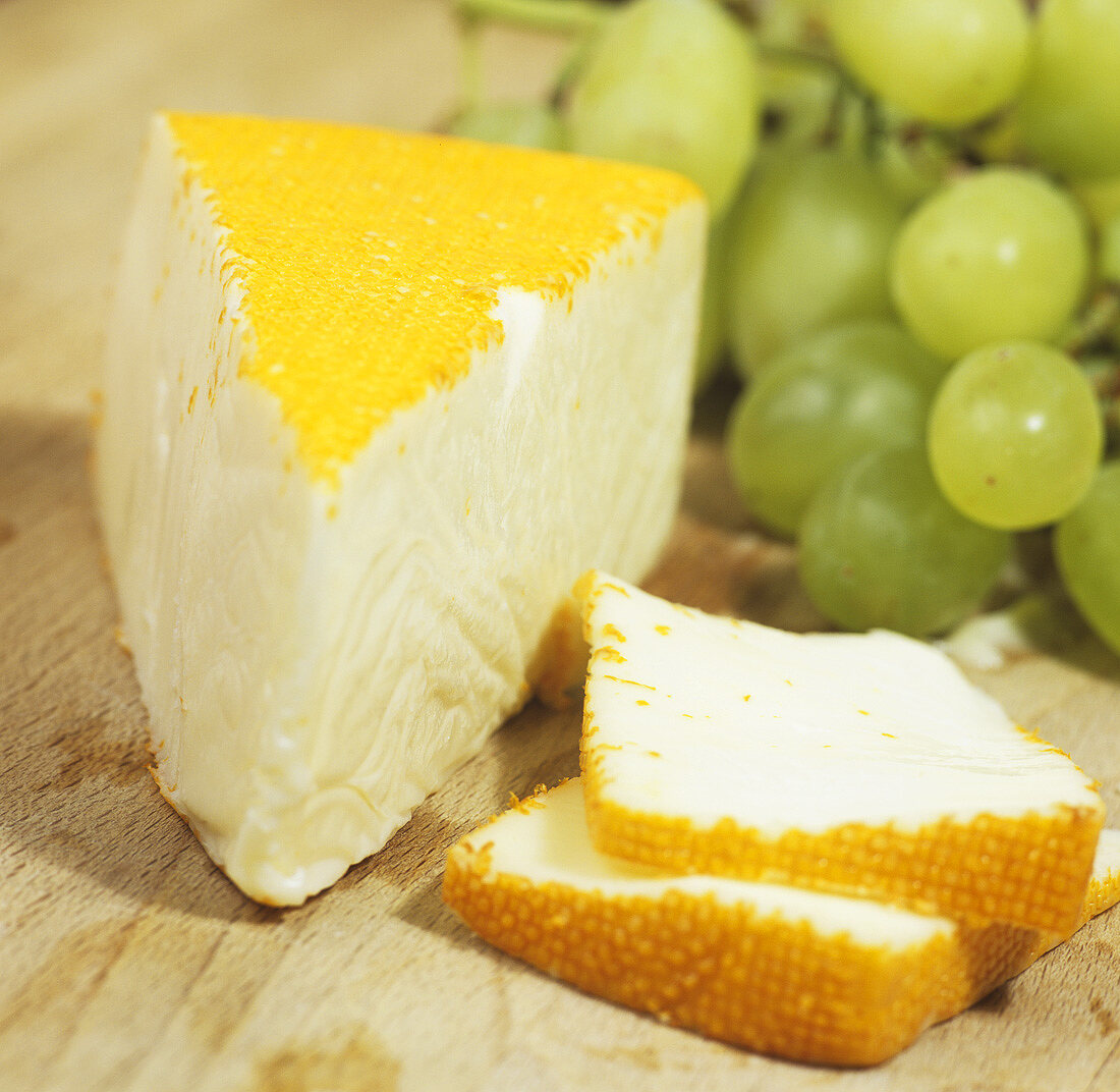 Port Salut cheese with grapes