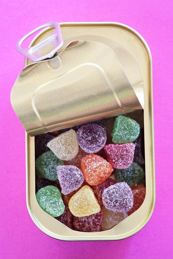 Coloured sugar-coated jelly sweets in a tin