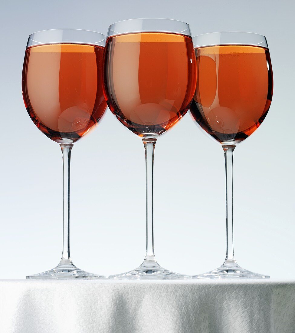 Rosé wine in three glasses