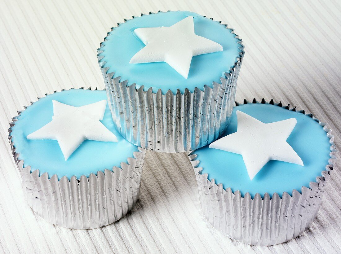 Cupcakes with blue icing and stars