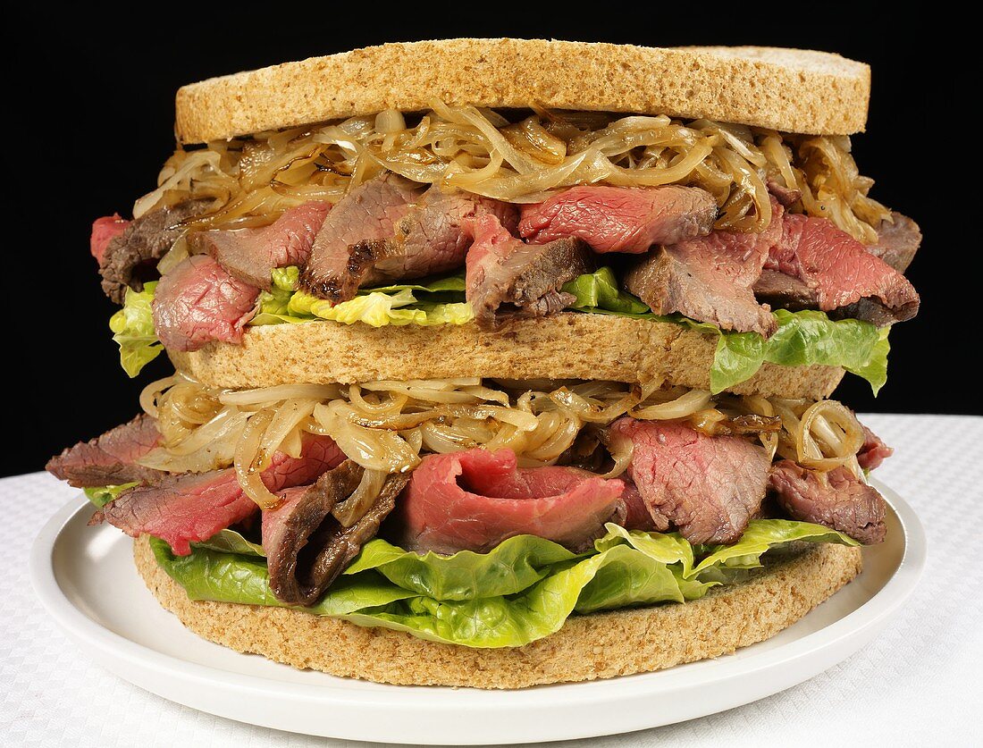 Double-decker roast beef and onion sandwich