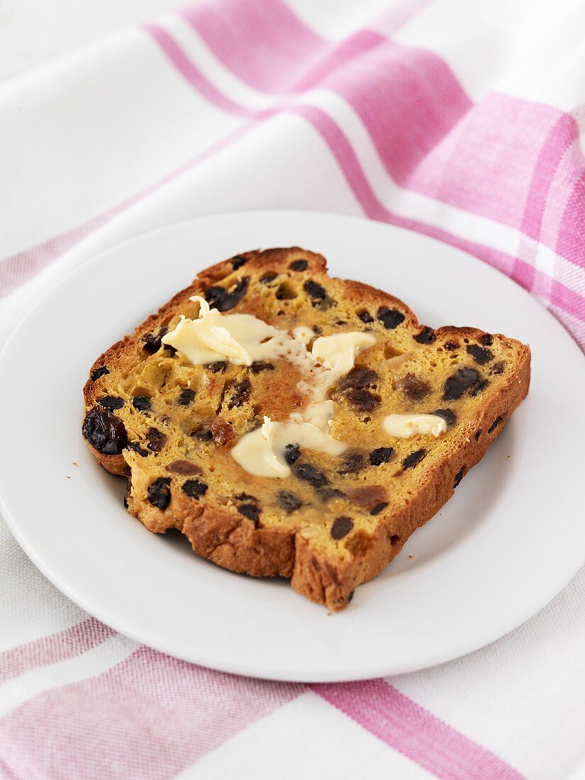 Buttered, toasted saffron bread with raisins