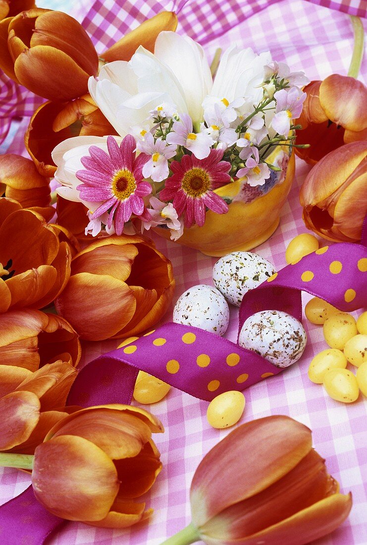 Flower arrangement, sugar eggs, quails' eggs and ribbon