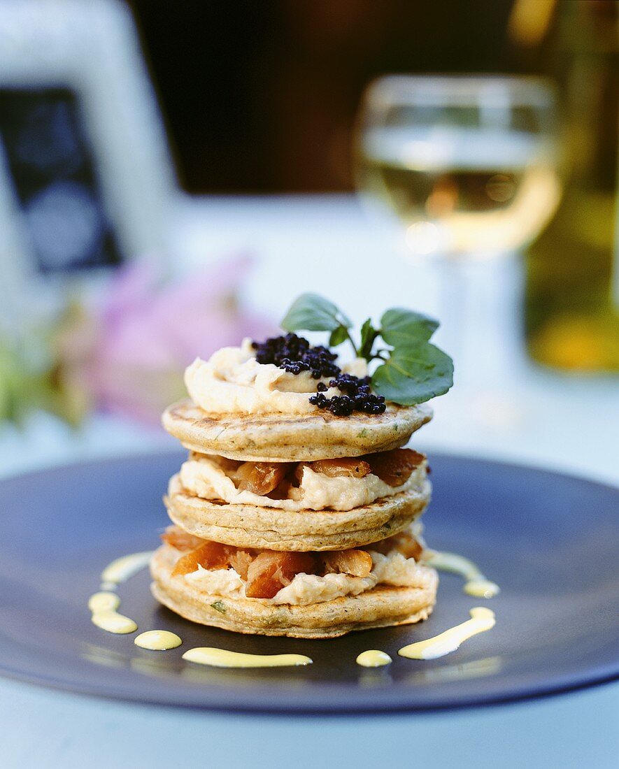 Pancakes with salmon and caviar