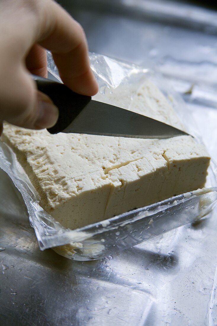 Cutting tofu into pieces