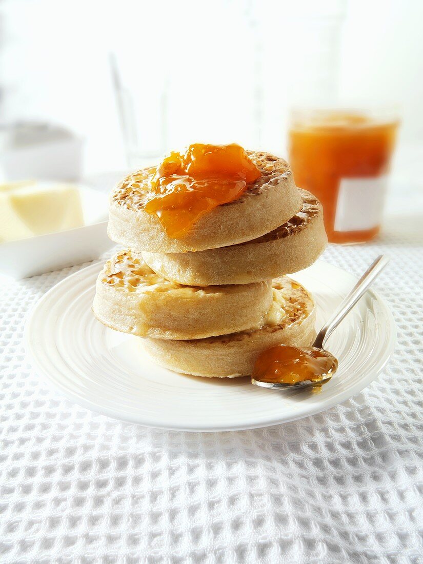 Crumpets with butter and apricot jam