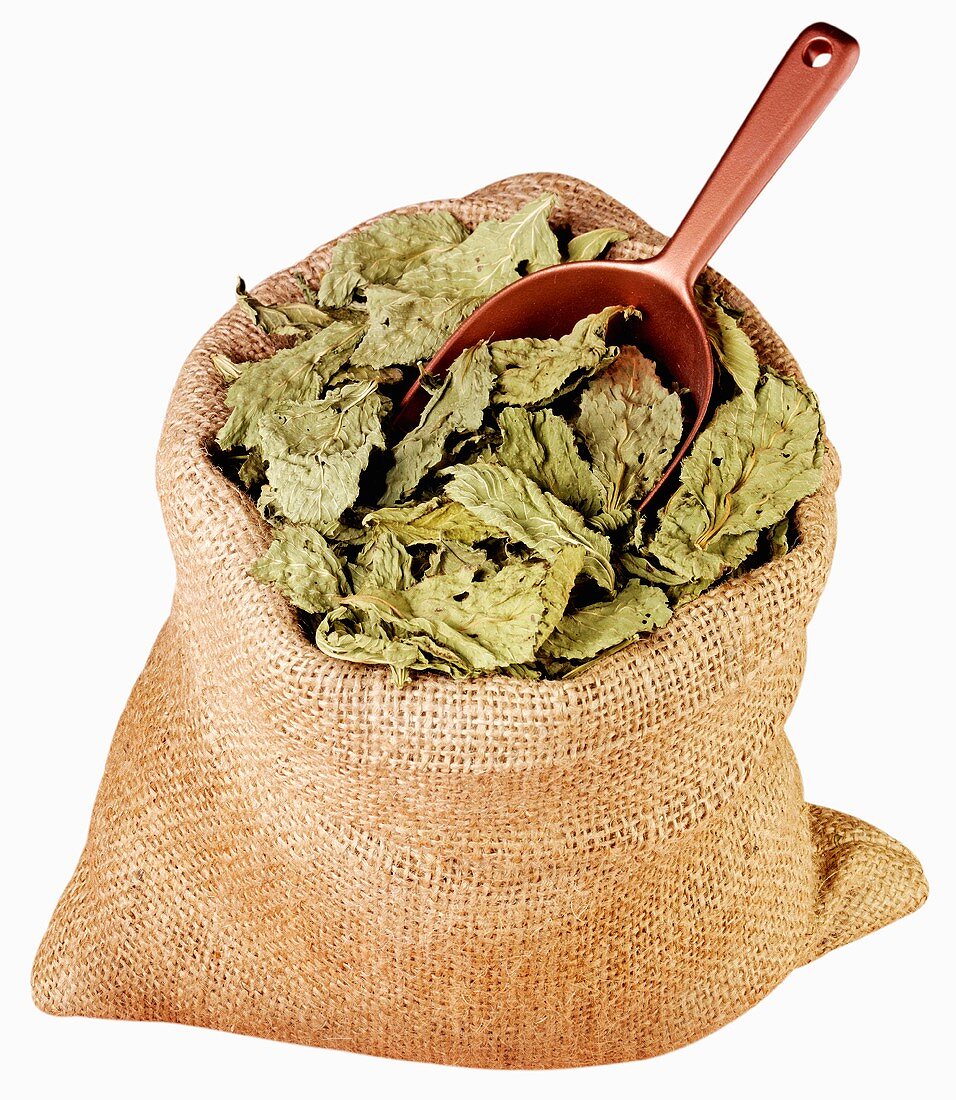 Dried Molohiya leaves in jute sack with scoop