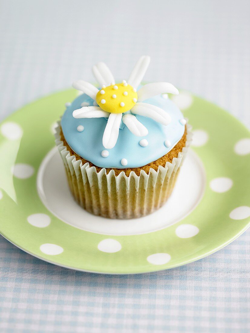 A cupcake with a sugar flower