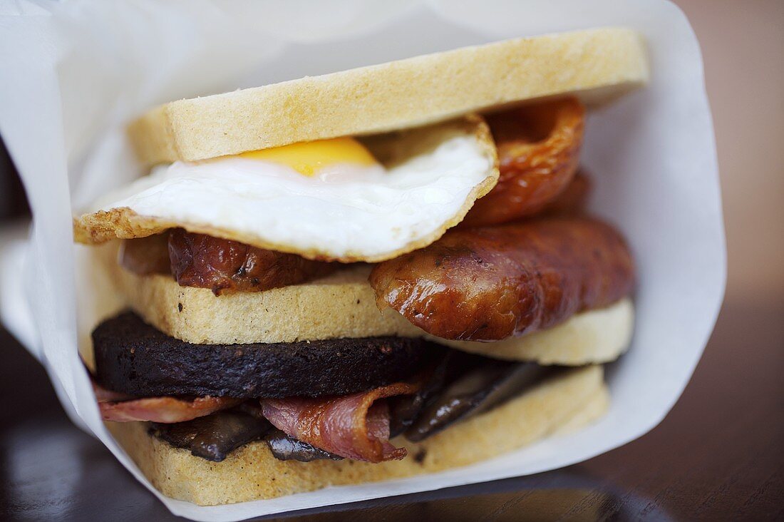 English breakfast sandwich: fried egg, black pudding etc.