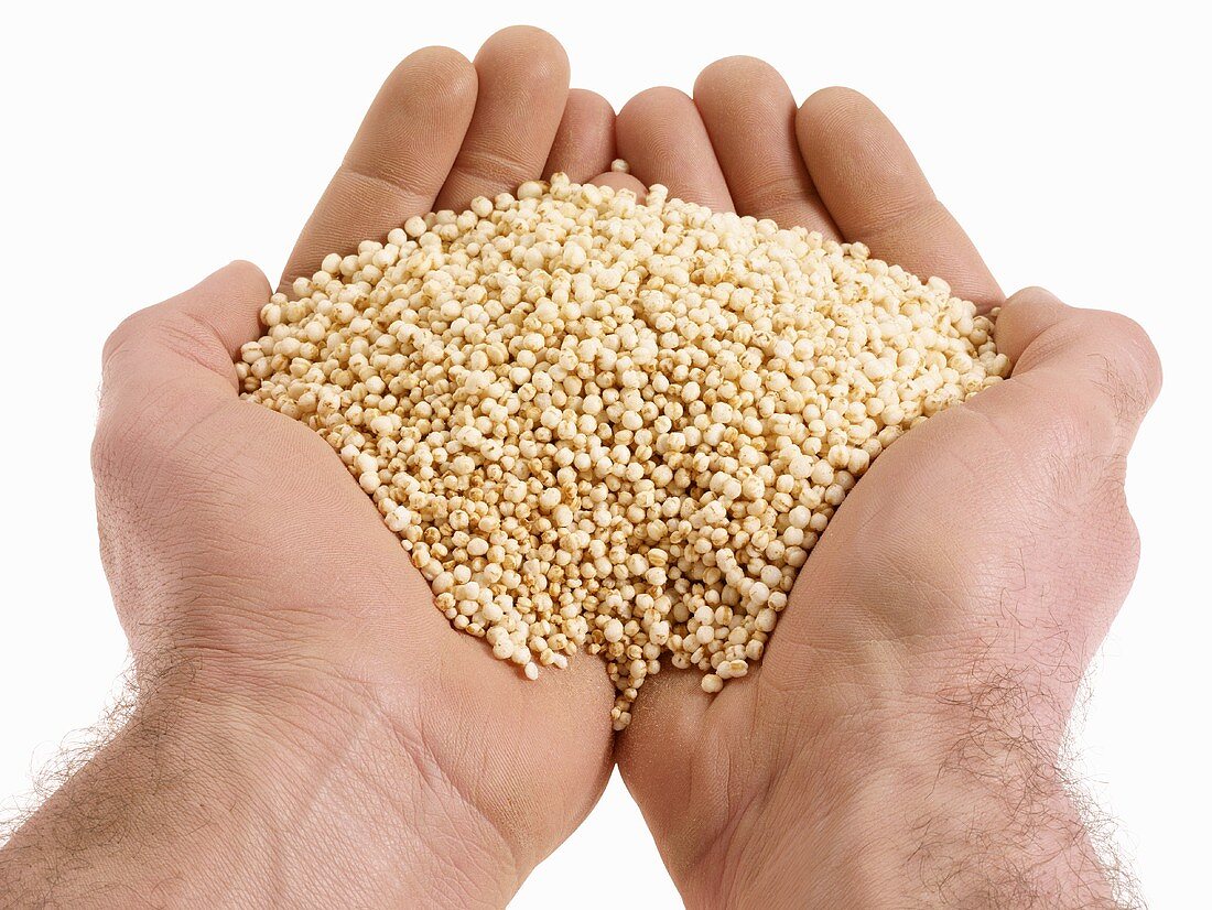 Hands holding quinoa