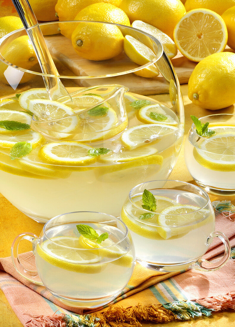 Lemonade in punchbowl and glasses