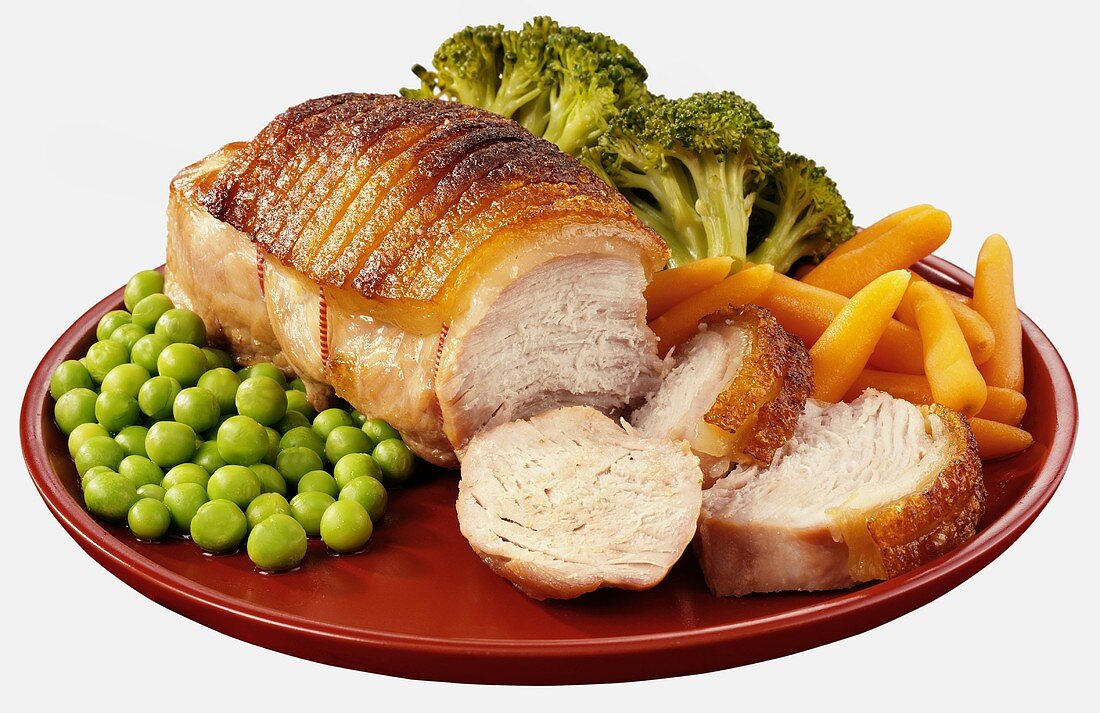Roast loin of pork with peas, carrots and broccoli