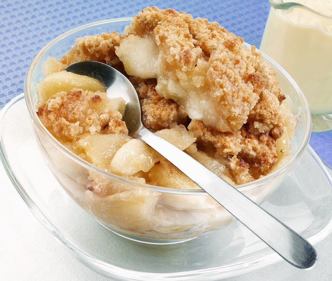 Apple crumble in a glass bowl