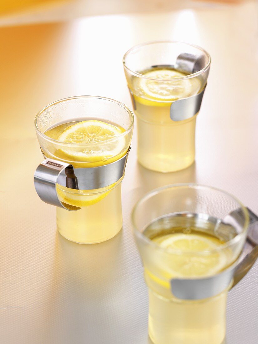 Three glasses of hot toddy (Hot lemon drink, Scotland)