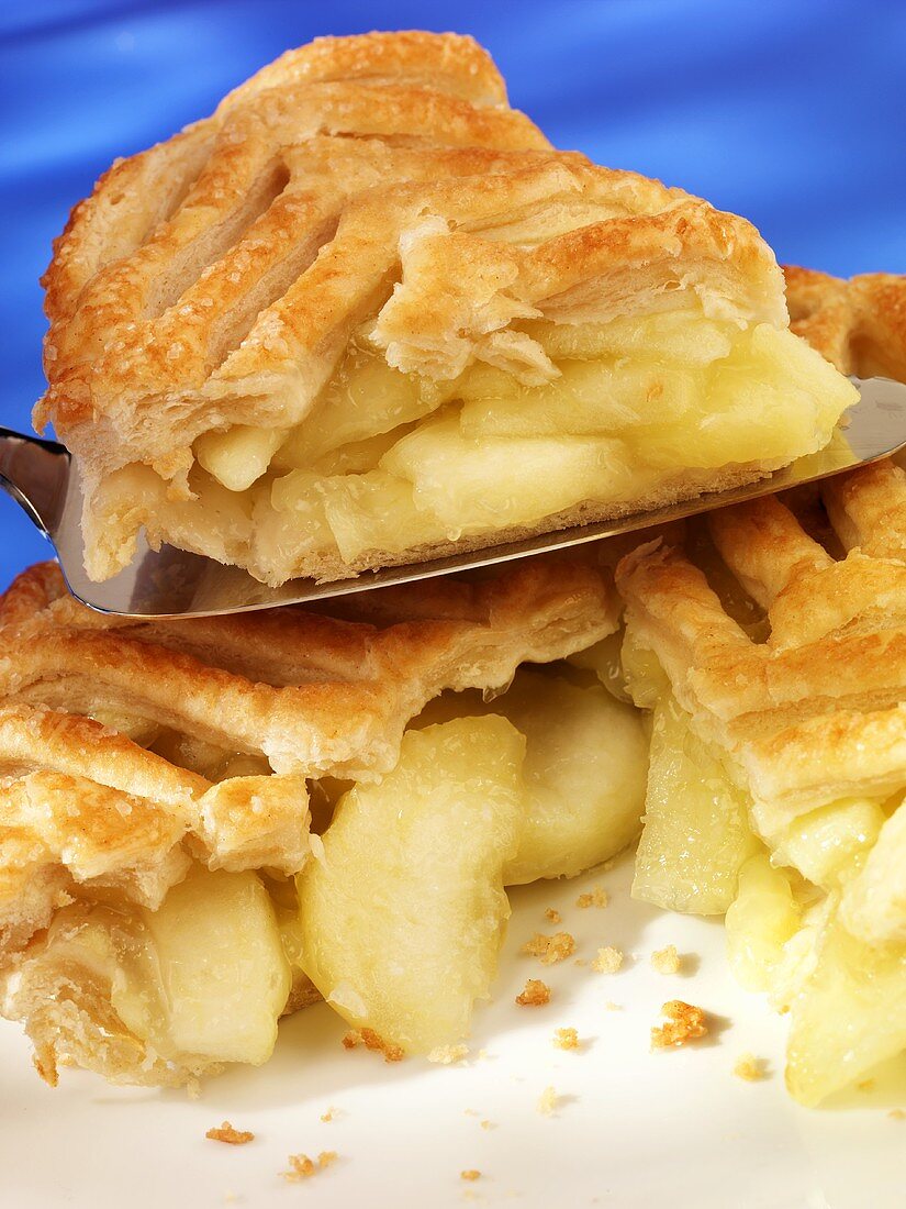 Puff pastry apple pie, one piece on server