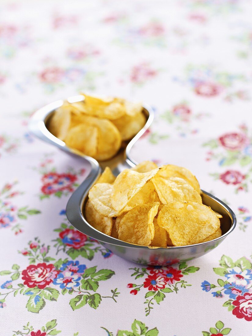 Potato crisps in a metal dish