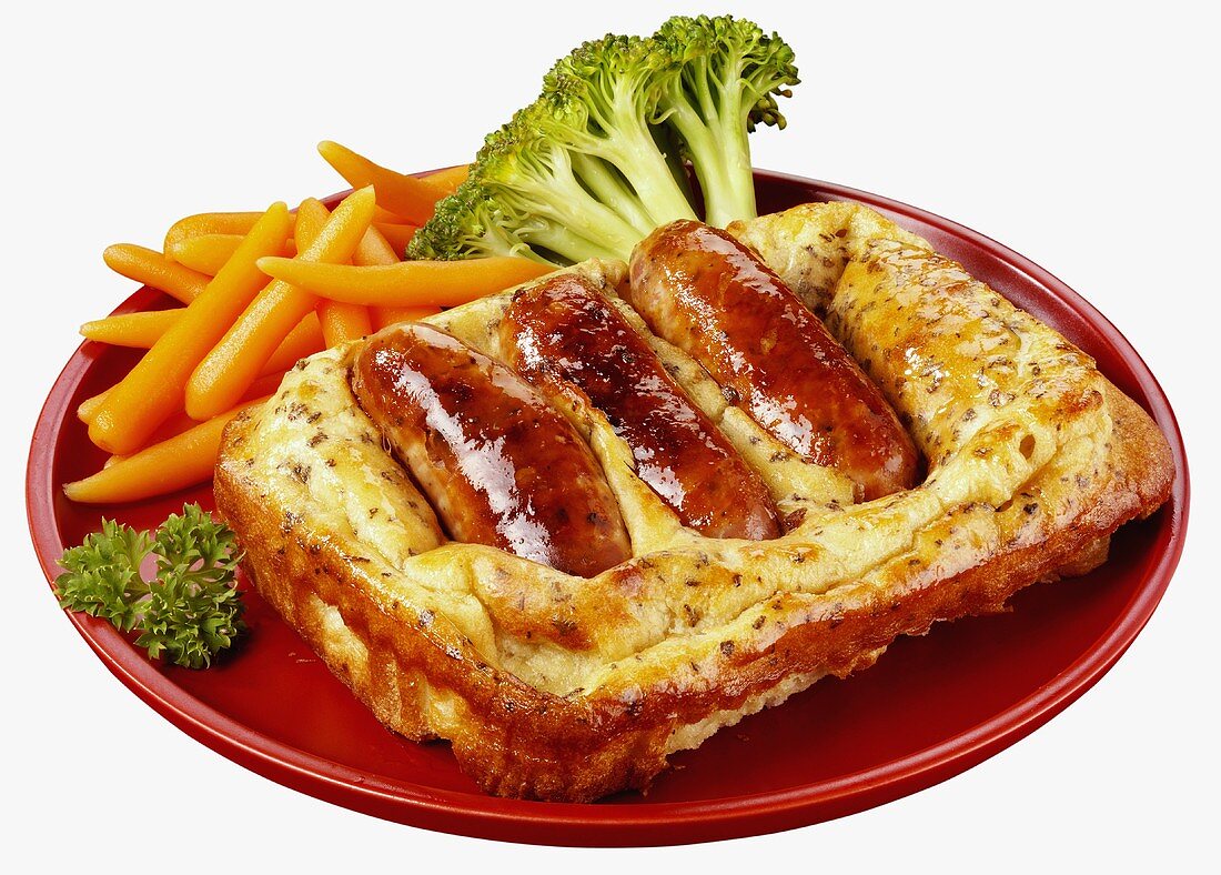 Toad-in-the-hole with vegetables on a plate