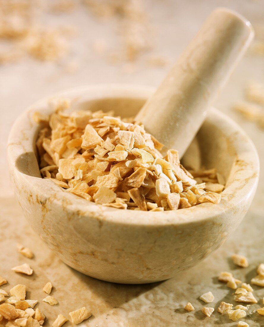 Dried garlic in a mortar