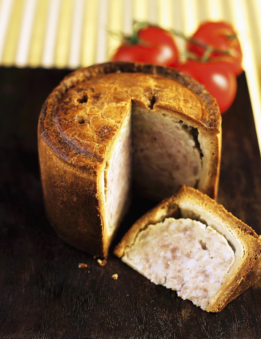 Pork pie with a portion removed (UK)