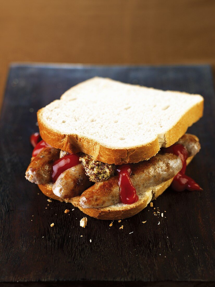 A sausage sandwich with ketchup