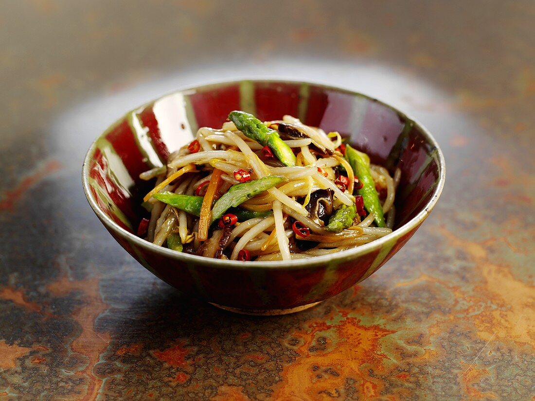 Fried sprouts, asparagus, jelly ear fungus in a bowl