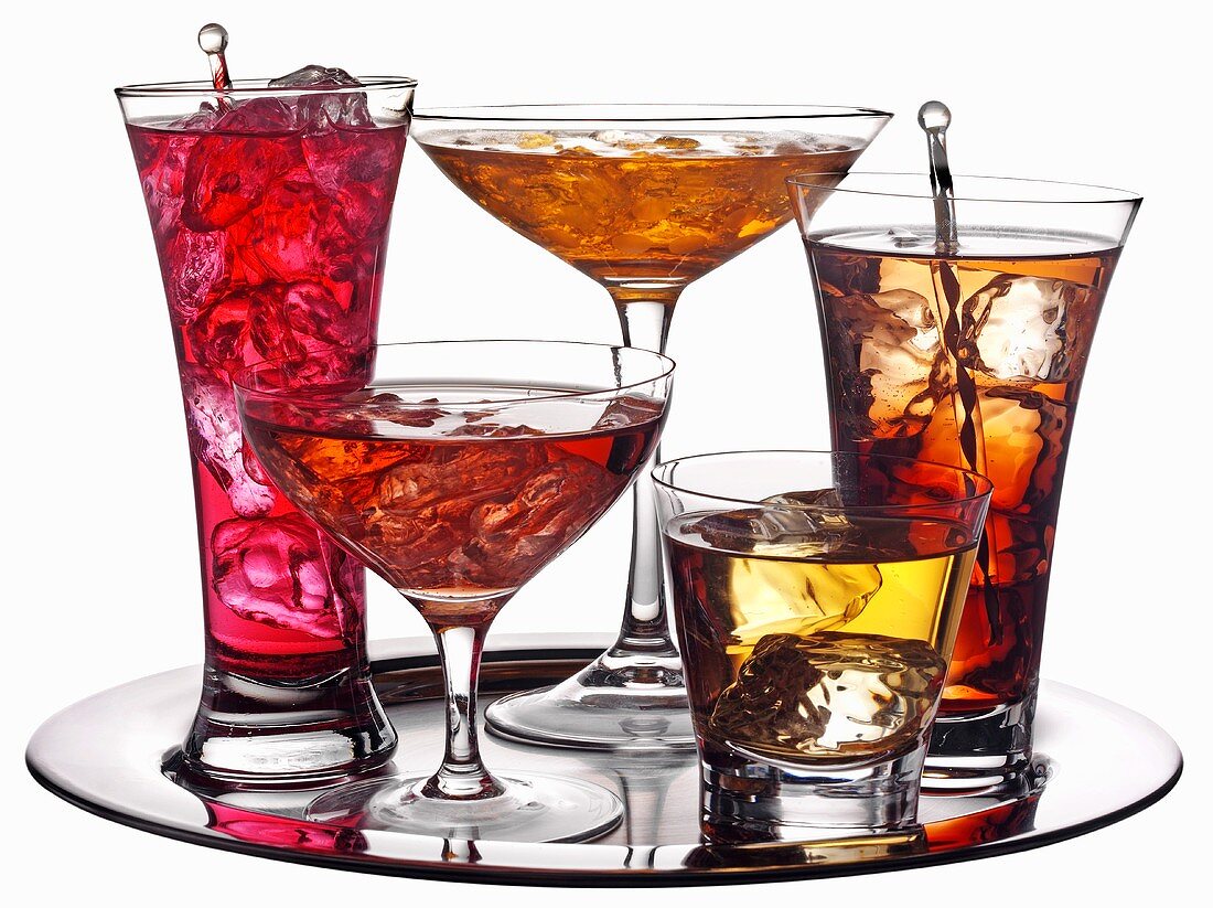 Various coloured cocktails on a tray