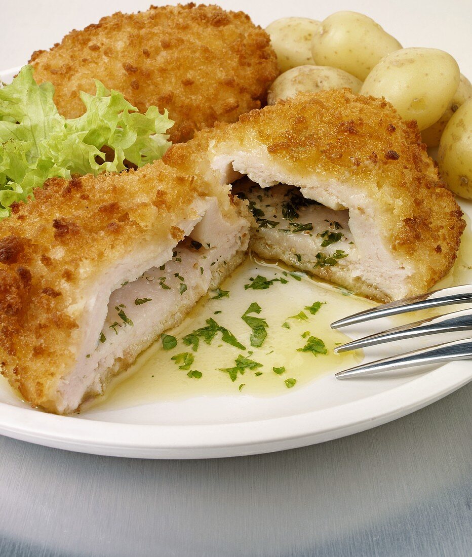 Chicken Cordon Bleu with herbs, garlic and potatoes