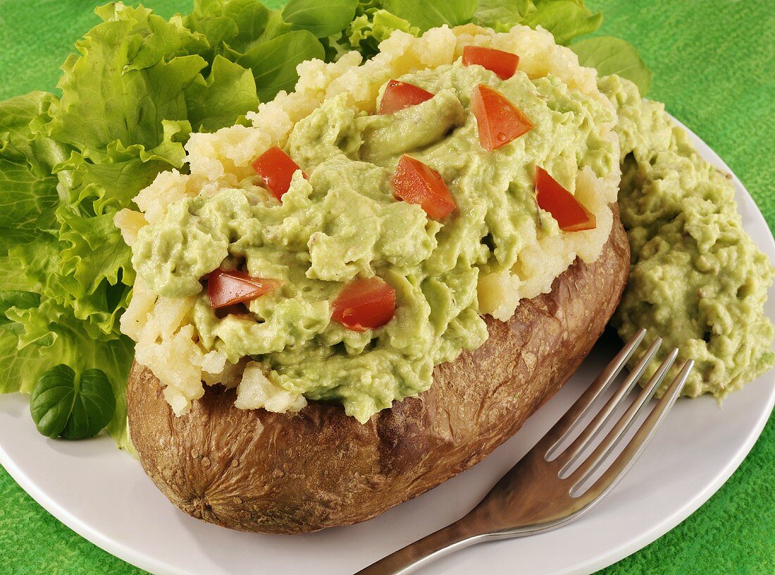 A baked potato with guacamole