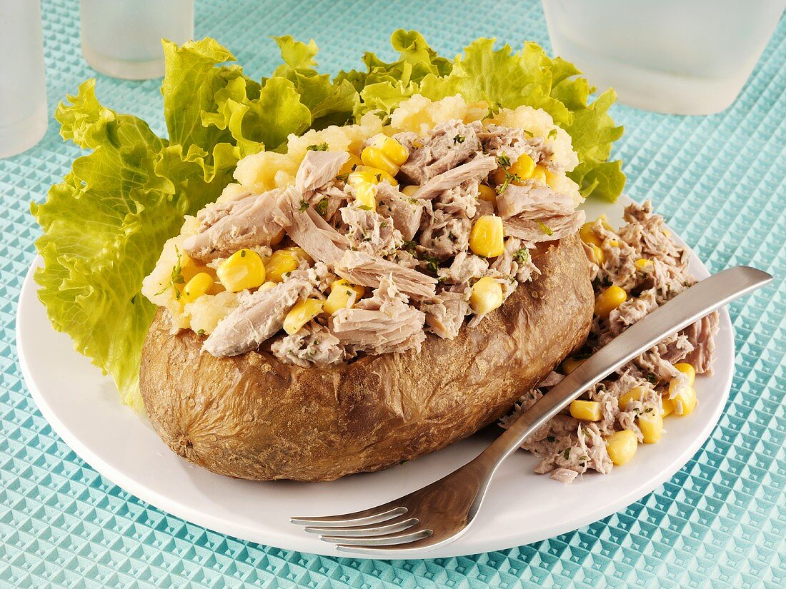 A baked potato with tuna and sweetcorn