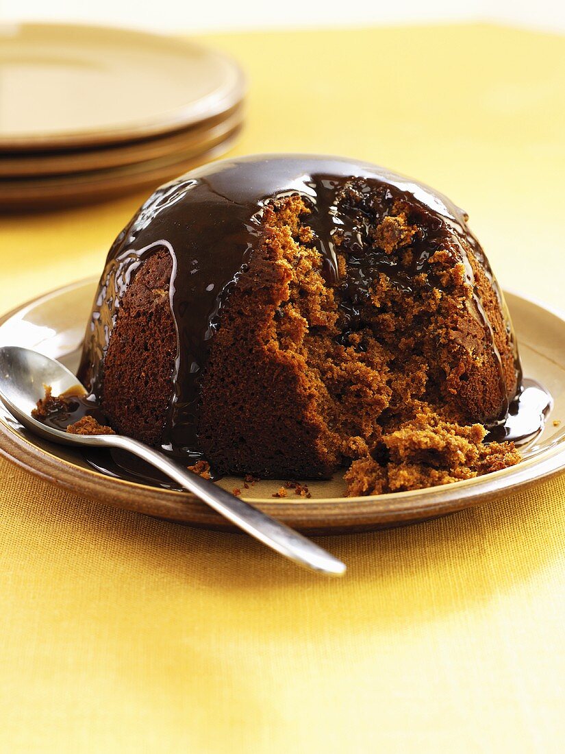 Sticky toffee pudding with chocolate sauce (UK)