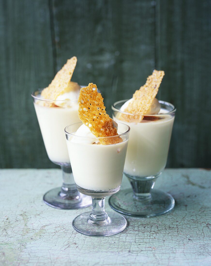 Rum panna cotta with coconut ice cream in three glasses