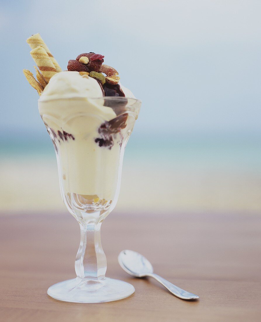 Ice cream with dried fruit and wafers in sundae glass