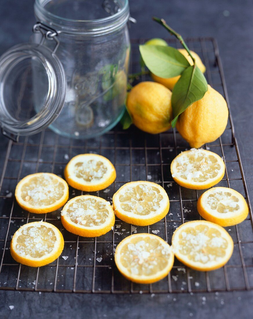 Lemon slices sprinkled with salt ready for pickling