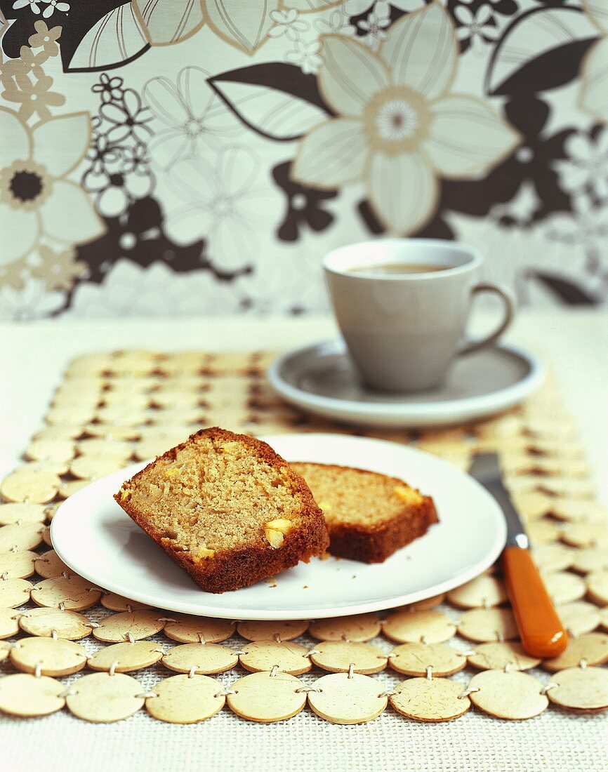 Two slices of pineapple cake with a cup of tea