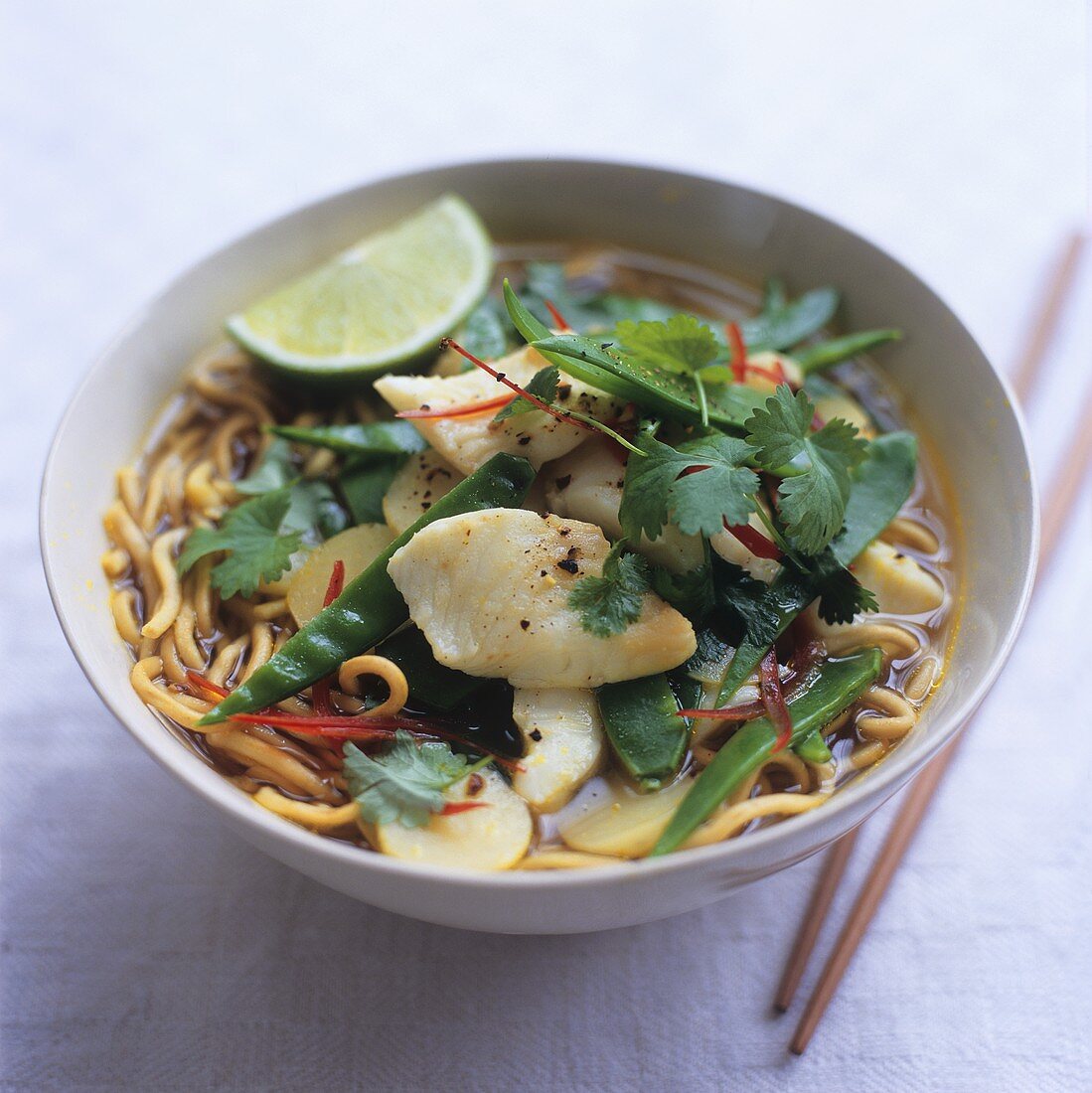 Asian noodle soup with fish