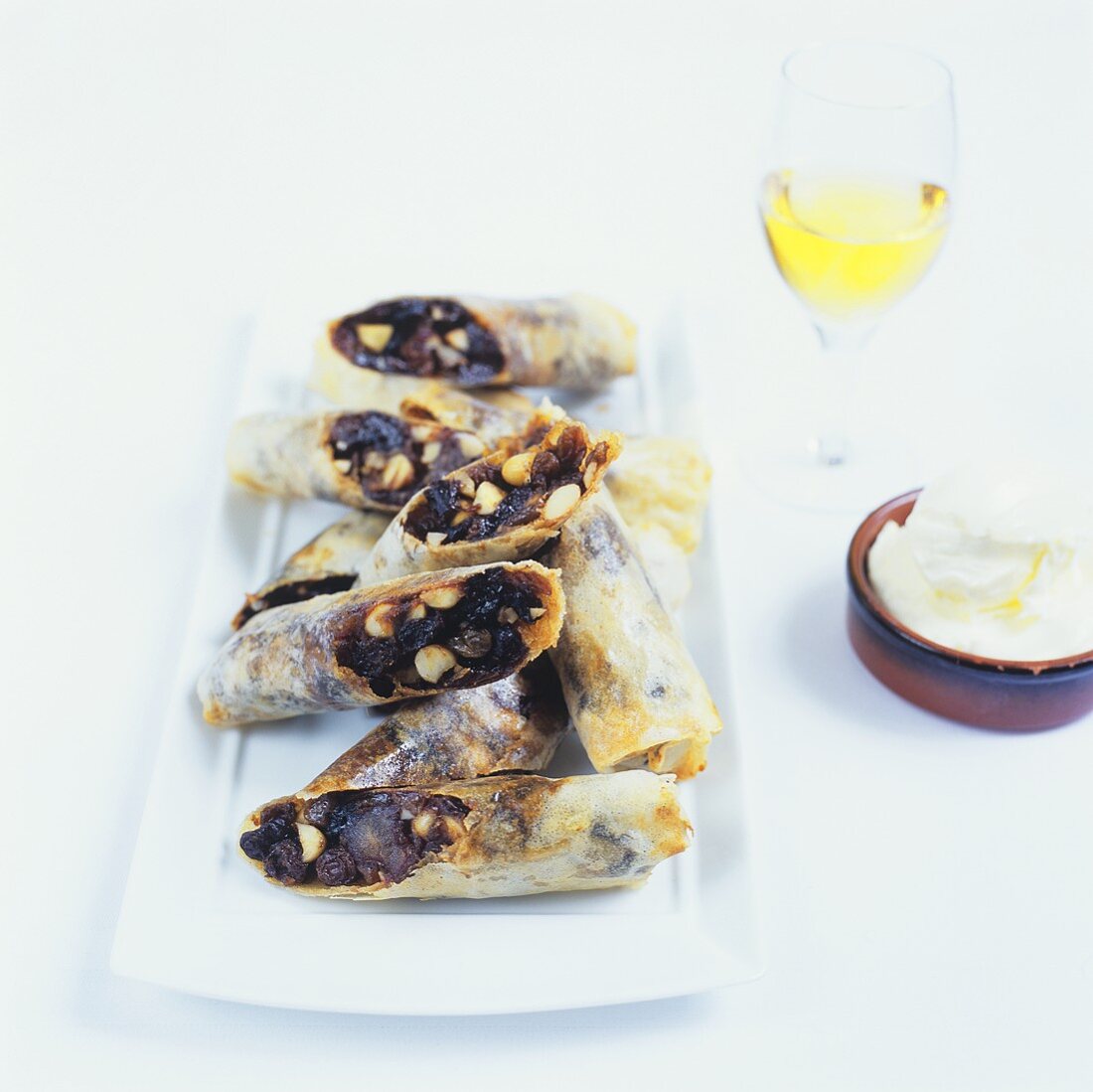 Deep-fried pastry rolls filled with dried fruit and nuts