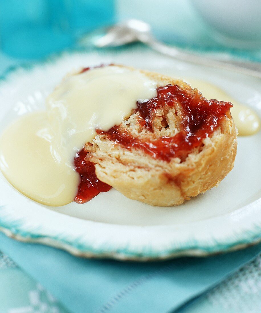Yeast pastry with jam and vanilla sauce
