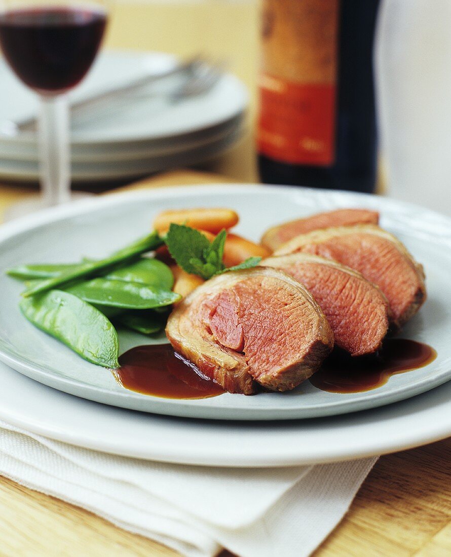 Saddle of lamb with gravy and vegetables
