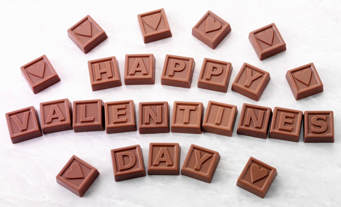 Chocolate squares with letters spelling 'Happy Valentine's Day'