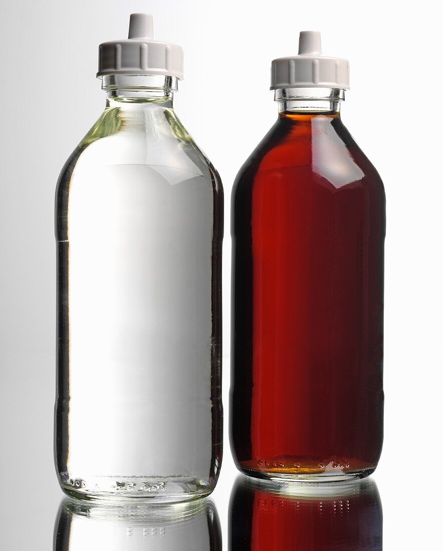 Two different bottles of vinegar
