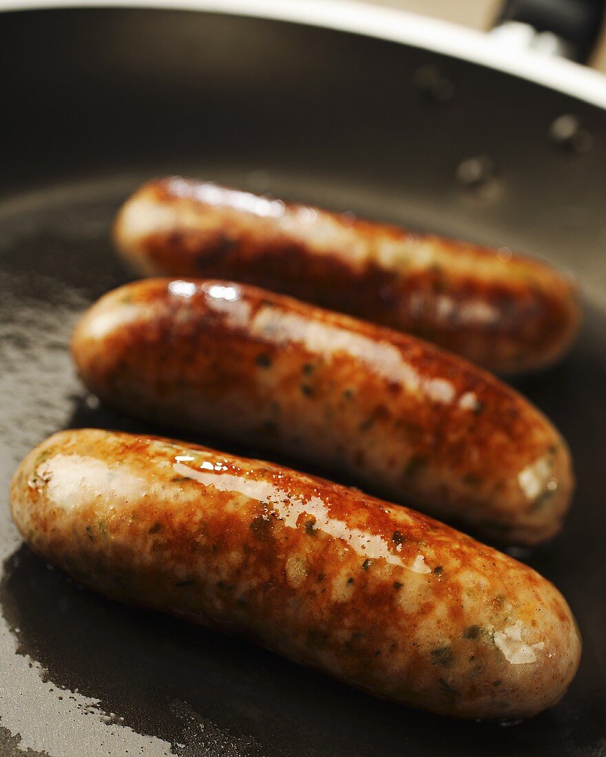 Sausages in a frying pan