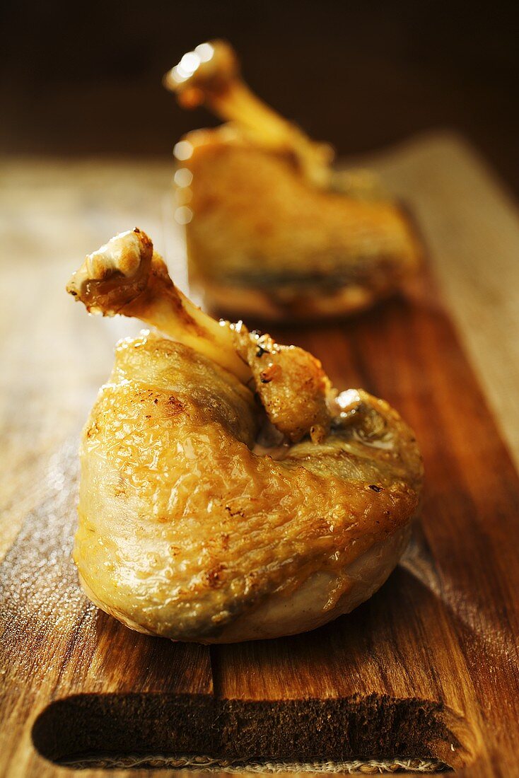 Roast pheasant breasts on chopping board