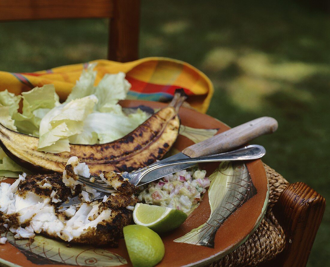 Fillet of cajun-style fish with grilled banana