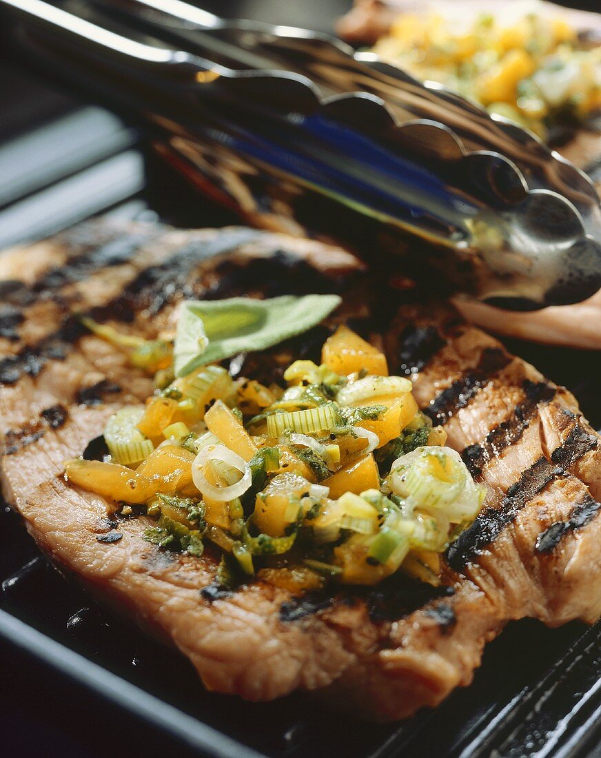 Grilled smoked pork chop with apricot salsa