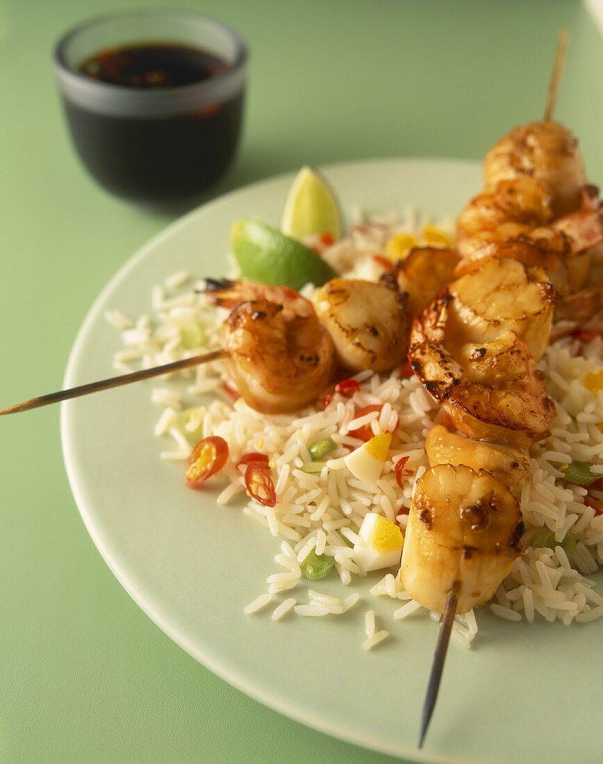 Seafood kebabs on a bed of rice