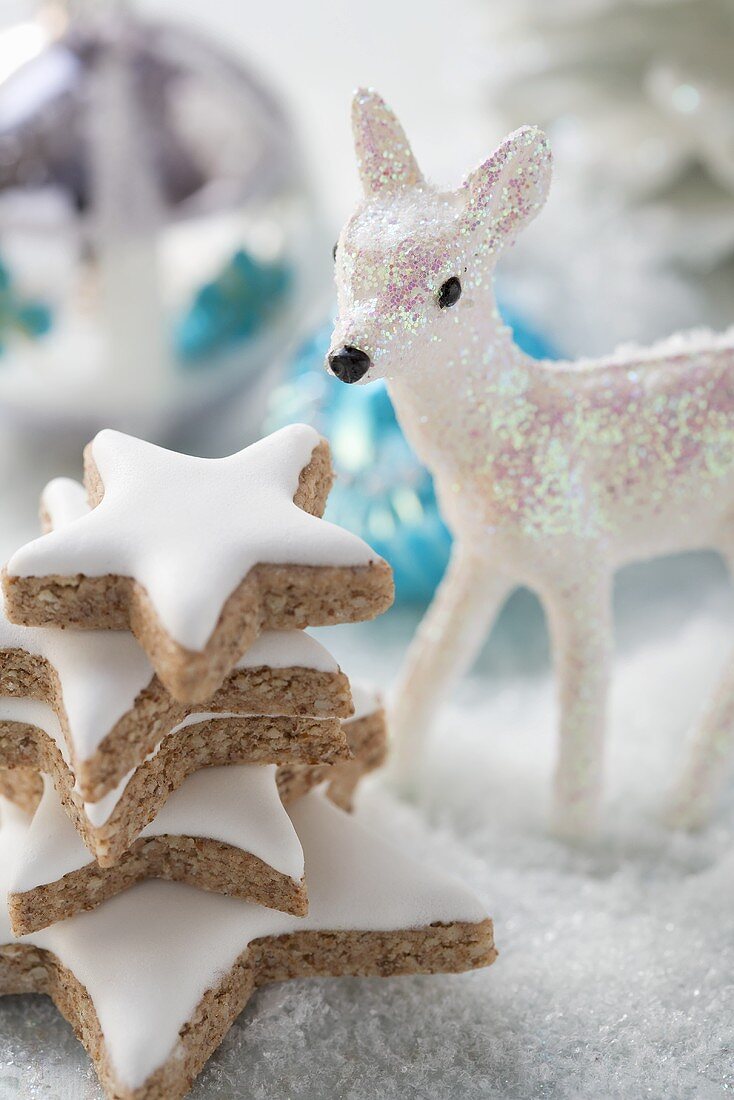 Cinnamon stars surrounded by Christmas decorations