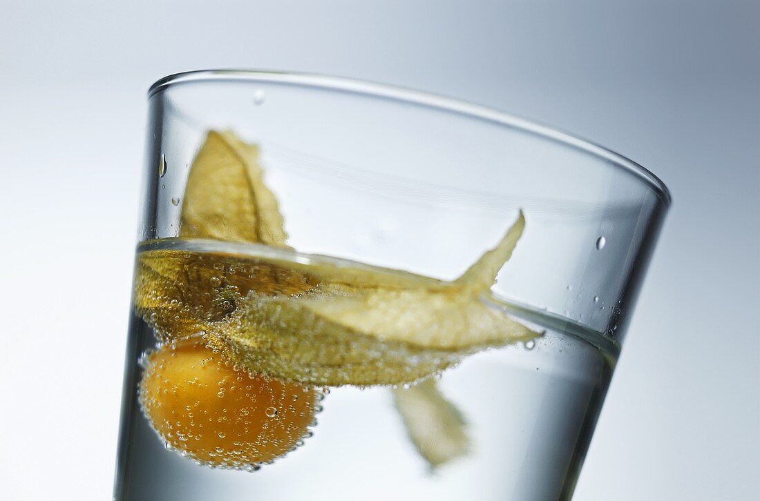 Opened physalis in a glass of water