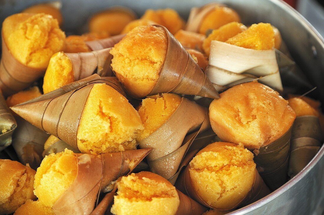 Fresh palm sugar wrapped in palm leaves
