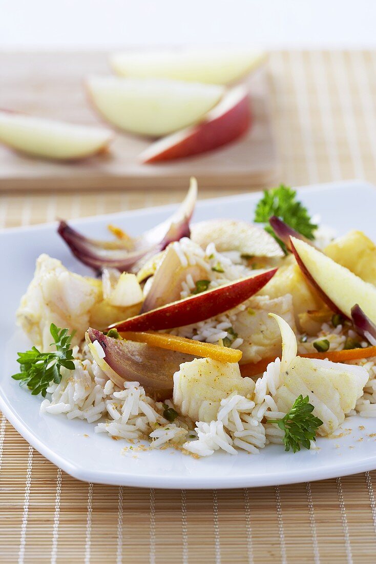 Fish curry with rice, apple and onion