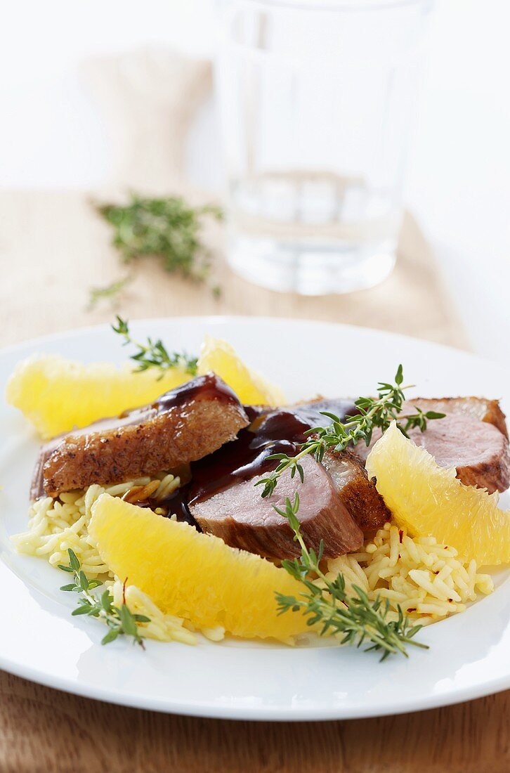 Duck breast with rice, grapefruit segments and thyme